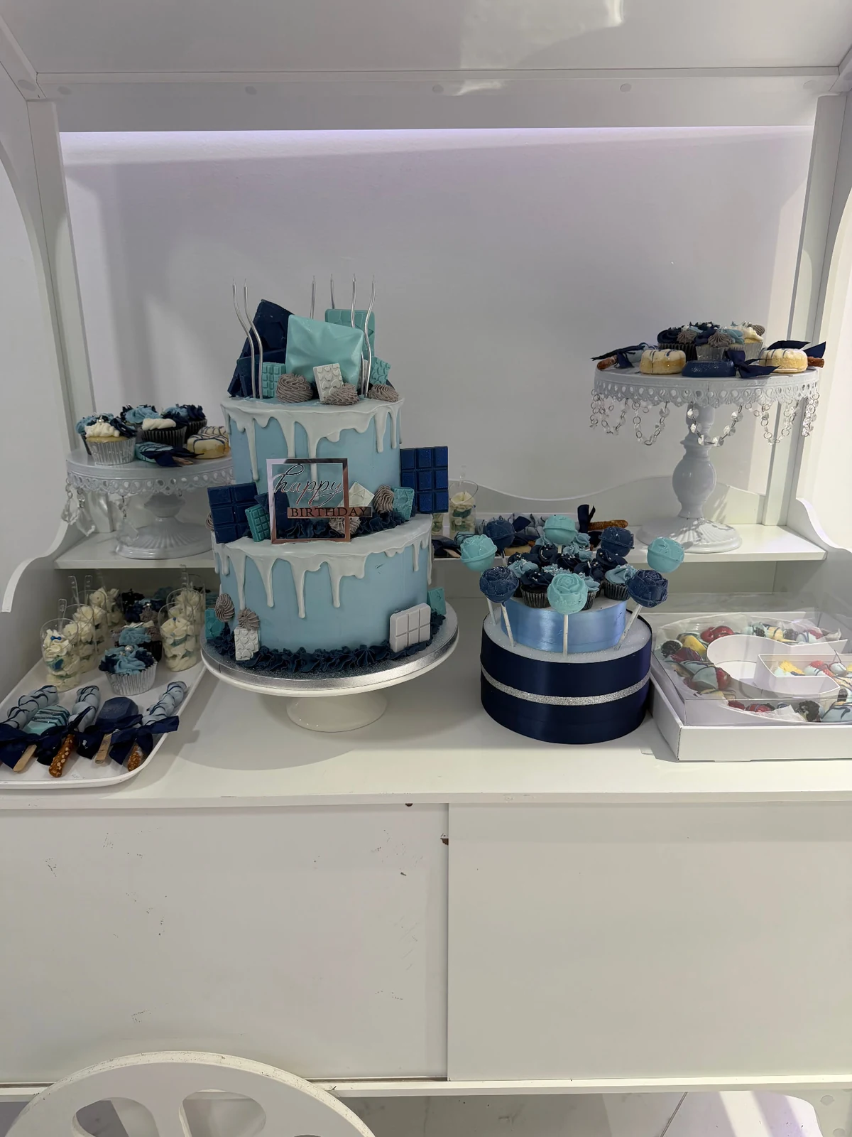 Blue cake with matching handcrafted sweets